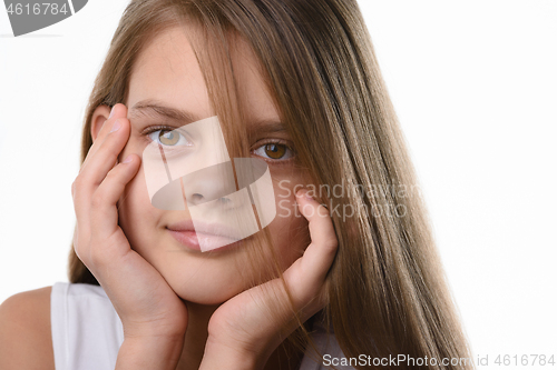 Image of Portrait of a beautiful teenage girl, Caucasian appearance, with long brown hair