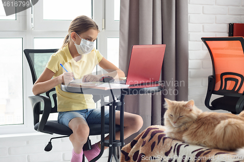 Image of Quarantined girl watching training video lessons in a laptop