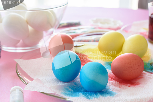 Image of Painting in different colors of eggs for Easter