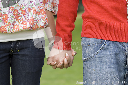 Image of Couple holding hands