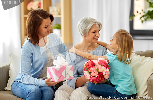 Image of granddaughter hugging and greeting grandmother