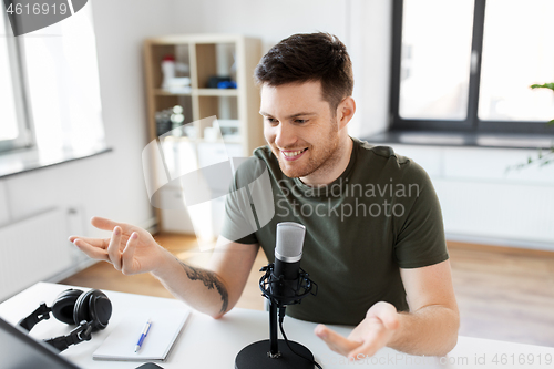 Image of male blogger with microphone audio blogging