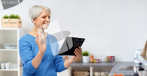 Image of senior woman having video call on tablet computer