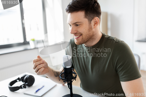Image of male blogger with microphone audio blogging