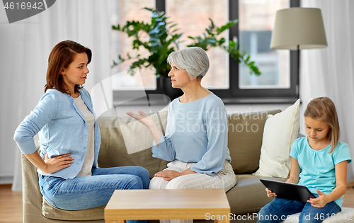 Image of daughter, mother and grandmother arguing at home