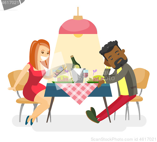 Image of Young multiracial couple at romantic date.