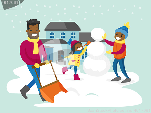 Image of Father removing snow while his kids making snowman