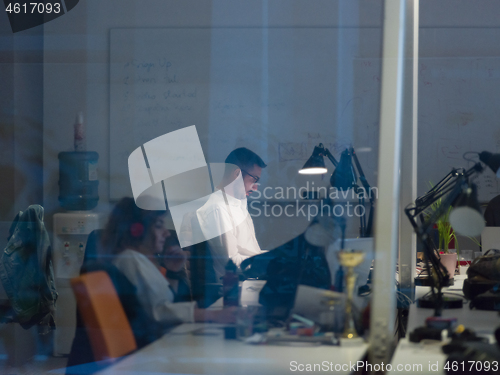Image of businessman working using a laptop in startup office