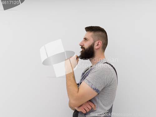 Image of portrait of bearded hipster handyman isolated on white