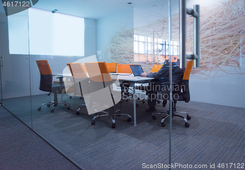 Image of businessman working using a laptop in startup office