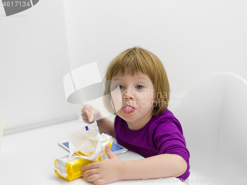 Image of little girl playing games on tablet computer