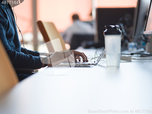 Image of businessman working using a laptop in startup office