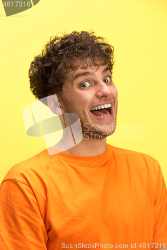 Image of The man screaming with open mouth isolated on yellow background, concept face emotion