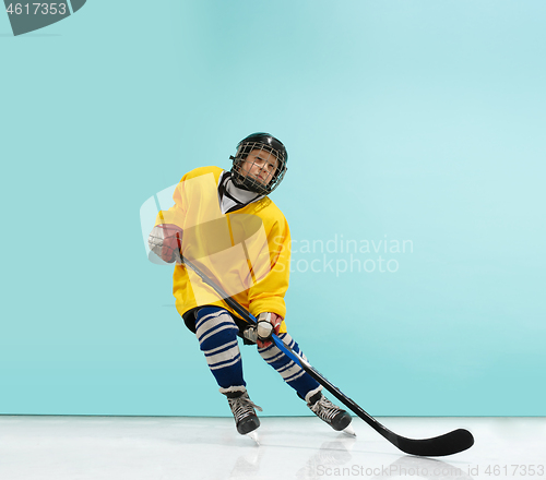 Image of A hockey player with equipment over a blue background