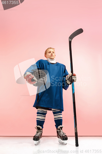 Image of A hockey player with equipment over a pink background