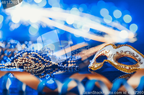 Image of Traditional female carnival venetian mask on bokeh background. Masquerade, Venice, Mardi Gras, Brazil concept