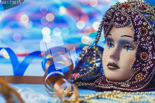 Image of Traditional female carnival venetian mask on bokeh background. Masquerade, Venice, Mardi Gras, Brazil concept