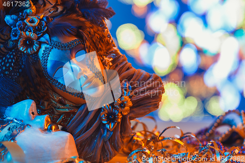 Image of Traditional female carnival venetian mask on bokeh background. Masquerade, Venice, Mardi Gras, Brazil concept