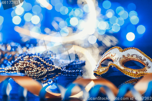 Image of Traditional female carnival venetian mask on bokeh background. Masquerade, Venice, Mardi Gras, Brazil concept