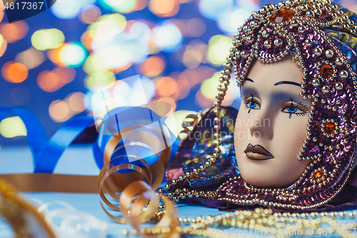 Image of Traditional female carnival venetian mask on bokeh background. Masquerade, Venice, Mardi Gras, Brazil concept