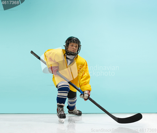 Image of A hockey player with equipment over a blue background