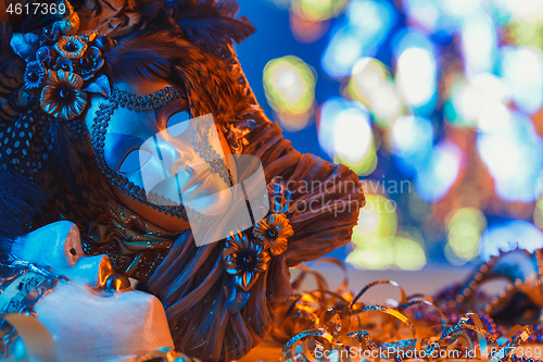 Image of Traditional female carnival venetian mask on bokeh background. Masquerade, Venice, Mardi Gras, Brazil concept