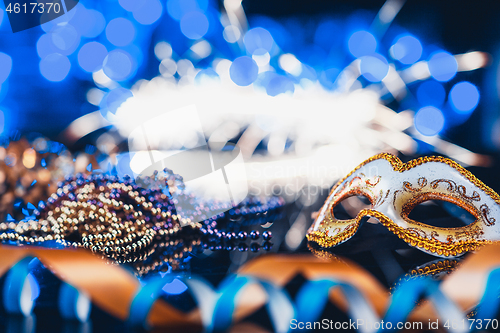 Image of Traditional female carnival venetian mask on bokeh background. Masquerade, Venice, Mardi Gras, Brazil concept