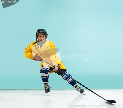 Image of A hockey player with equipment over a blue background