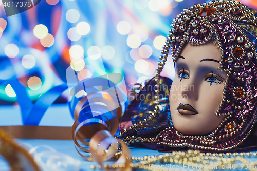 Image of Traditional female carnival venetian mask on bokeh background. Masquerade, Venice, Mardi Gras, Brazil concept