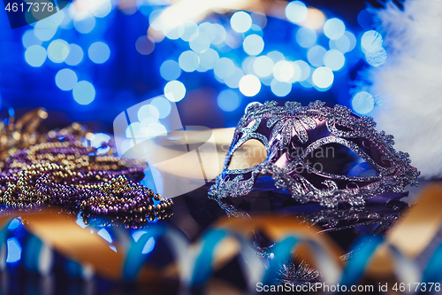 Image of Traditional female carnival venetian mask on bokeh background. Masquerade, Venice, Mardi Gras, Brazil concept