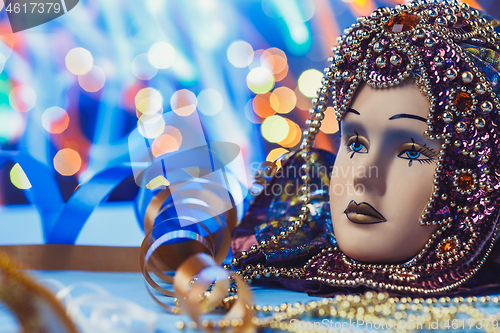 Image of Traditional female carnival venetian mask on bokeh background. Masquerade, Venice, Mardi Gras, Brazil concept