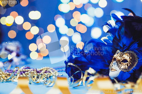 Image of Traditional female carnival venetian mask on bokeh background. Masquerade, Venice, Mardi Gras, Brazil concept