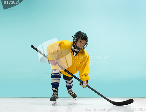 Image of A hockey player with equipment over a blue background