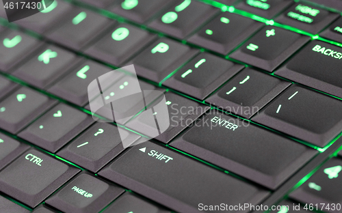 Image of Close up led backlit computer laptop keyboard