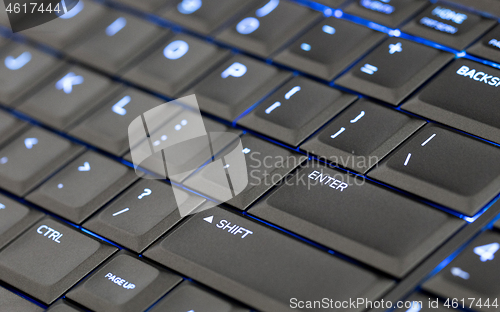 Image of Close up led backlit computer laptop keyboard