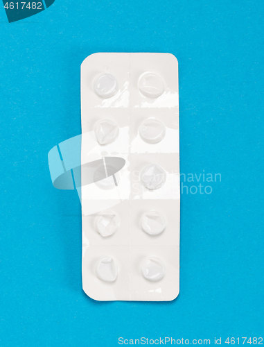 Image of Pill strip on blue on background