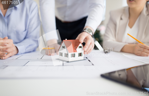 Image of close up of architects discussing house project