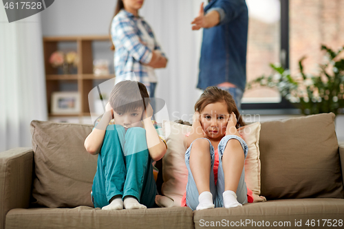 Image of sad children and parents quarreling at home