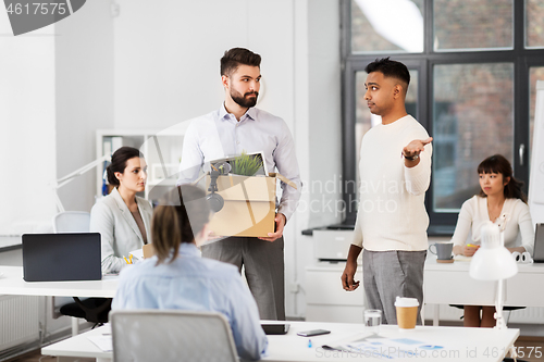 Image of fired sad male office worker leaving