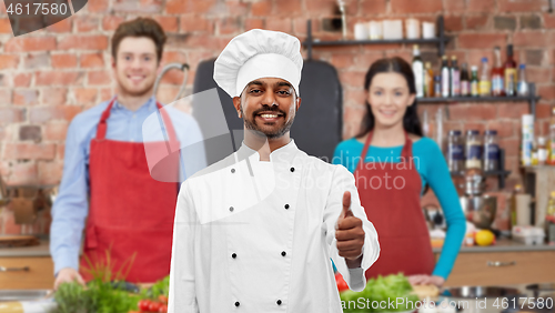 Image of indian chef showing thumbs up at cooking class