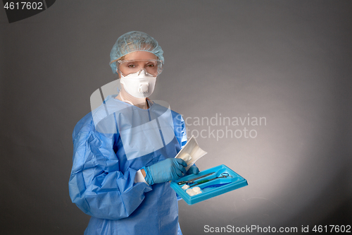 Image of Medical surgeon holding tools for operation