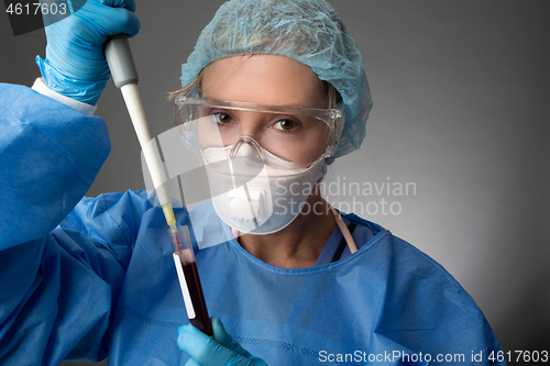 Image of Laboratory pathologist pipetting a patient blood sample