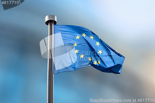 Image of European Union flag on a blurred background.