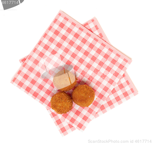 Image of Dutch traditional snack bitterbal on a red and white napkin