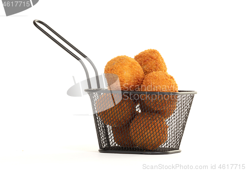 Image of Dutch traditional snack bitterbal in a small basket