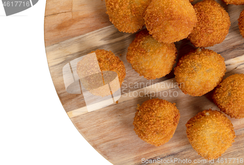 Image of Dutch traditional snack bitterbal on a serving board