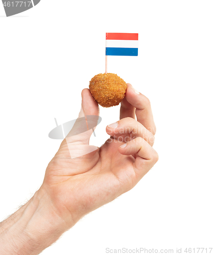 Image of Single dutch traditional snack bitterbal in a hand