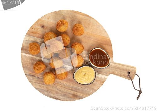 Image of Dutch traditional snack bitterbal on a serving board