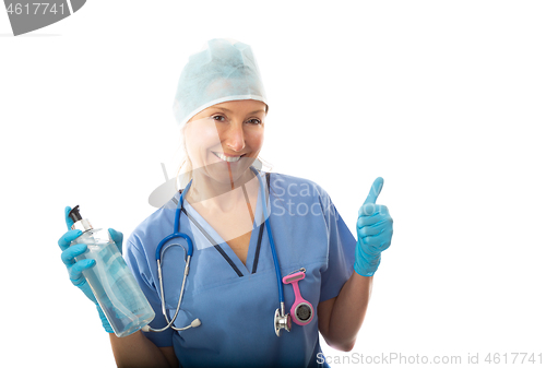 Image of Healthcare nurse holding a bottle of hand sanitiser and giving t