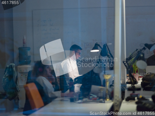 Image of businessman working using a laptop in startup office